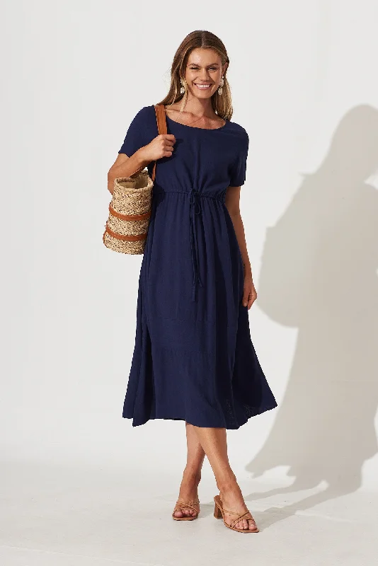 Midi dresses with ruffled bodices for a more pronounced feminine lookMary Midi Dress In Navy Linen Midi dresses with ruffled bodices for a more pronounced feminine lookMary Midi Dress In Navy Linen